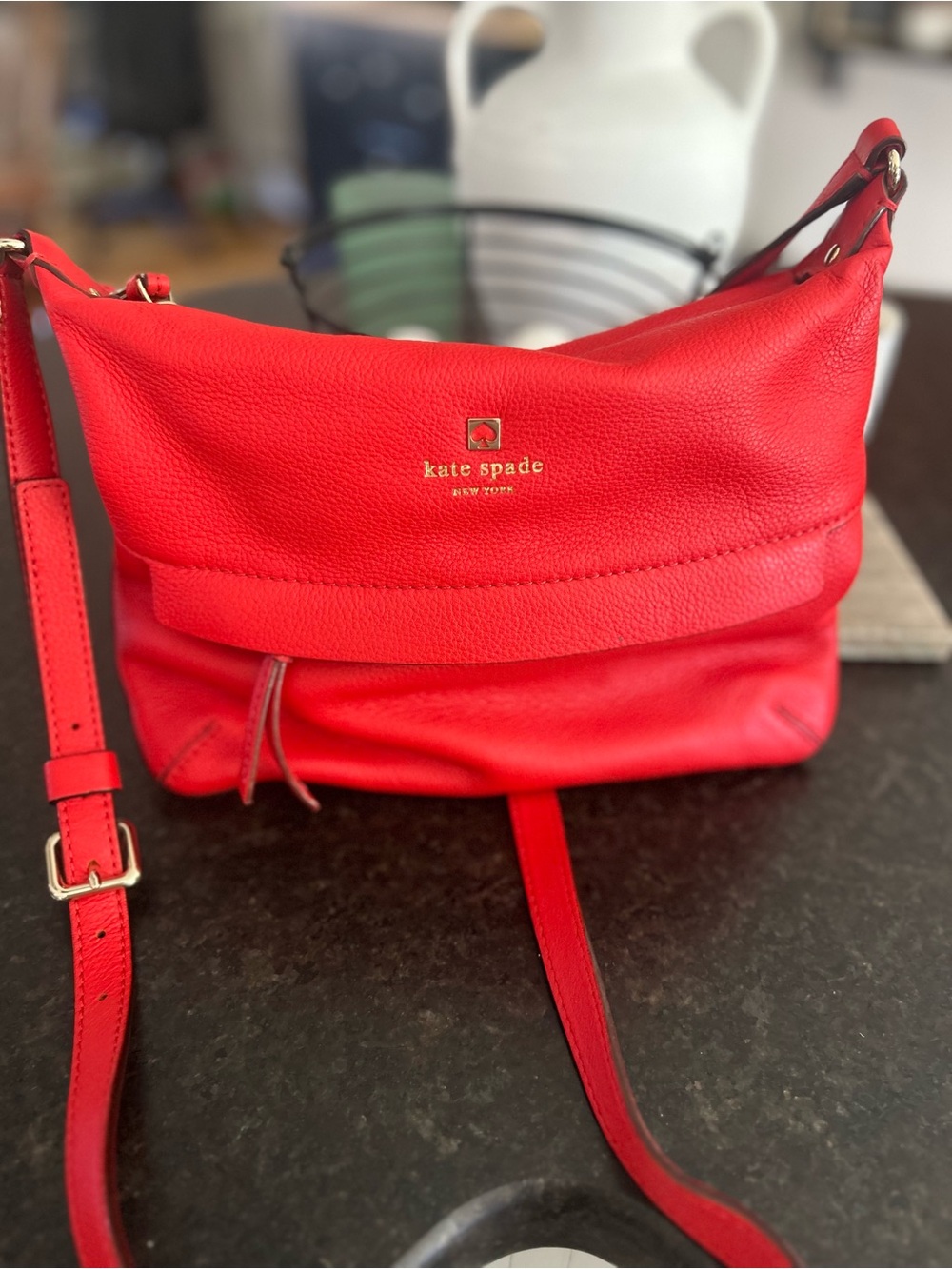 kate spade red pebbled leather crossbody with gold logo